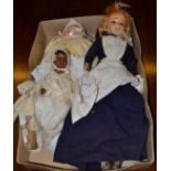 Wax head doll with blue eyes, two baby dolls with bisque heads, another doll and doll's parasol