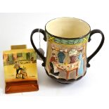 Royal Doulton loving cup 'Pottery In The Past' D6696 and a Sam Weller match striker