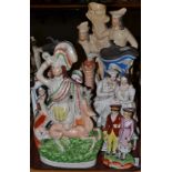 A collection of Staffordshire figures, two water jugs, etc