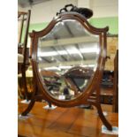 An Edwardian shield shape dressing table mirror