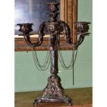 A good 19th century silver plated six branch candelabra with mask motifs and chain decoration