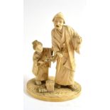 A good Japanese carved ivory okimono of a figure and attendant, signed to base, circa 1910