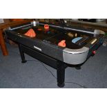 An air hockey table (in working condition)