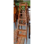 A pair of reproduction library steps with brass treads