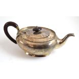 A silver teapot with a wooden handle, Adie Brothers, Birmingham 1948