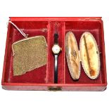 A red jewellery box containing a 9ct mounted chain mail purse, a 9ct gold cocktail stirrer (Samuel