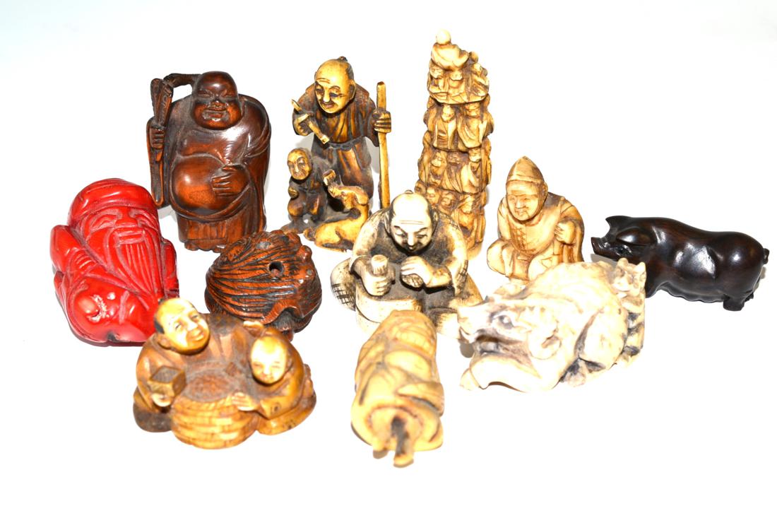 A collection of carved ivory, resin, wood and hardstone netsuke and carvings, circa 1920