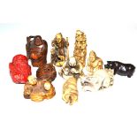 A collection of carved ivory, resin, wood and hardstone netsuke and carvings, circa 1920