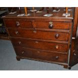 A late George III oak and mahogany crossbanded five drawer chest