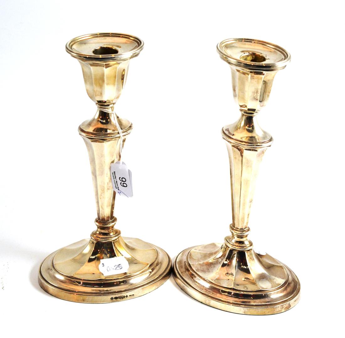 A pair of modern silver candlesticks in Neo Classical style
