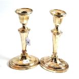 A pair of modern silver candlesticks in Neo Classical style