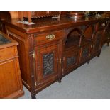 A late Victorian carved walnut sideboard