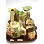 A tray including Royal Doulton, Sam Weller candlestick, Robin Hood teapot, Sairey Gamp jug, etc