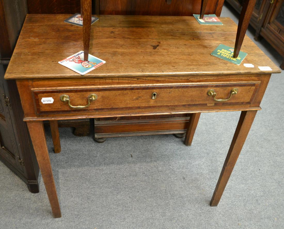 A George III oak and mahogany crossbanded side table