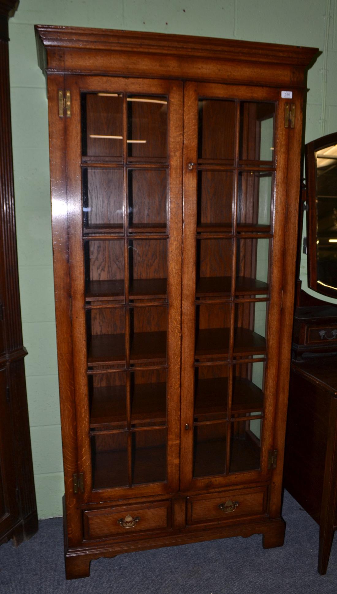 Titchmarsh & Goodwin oak display cabinet with leaded glass doors