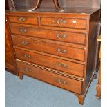 A late George III oak and mahogany crossbanded six drawer chest