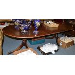 A mahogany twin pillar dining table in the Regency style