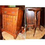 A reproduction small cabinet with simulated book front and a wine table