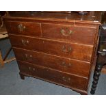 An oak and pine five drawer straight fronted chest of drawers