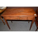 A George III mahogany fold-over tea table