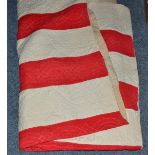 Late 19th century patchwork quilt with red and white striped reverse