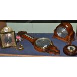 Two aneroid barometers, chiming mantel clock and a modern timepiece