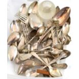 A large quantity of assorted silver and white metal teaspoons etc