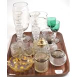 A tray of glass including an etched glass celery vase, silver topped glass jars, a pair of cut glass