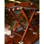 A mahogany and brass bound butler's tray on stand