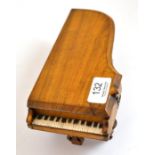 A miniature piano pen holder