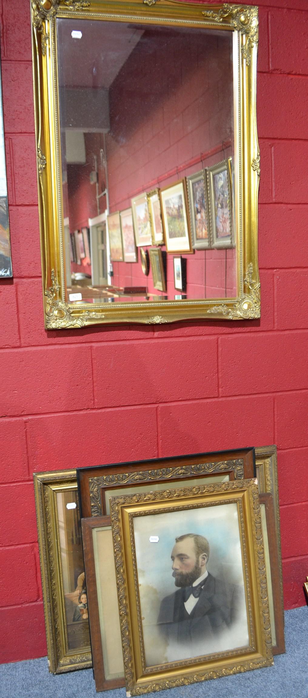 A reproduction gilt framed mirror and four Victorian prints