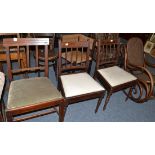 A set of three late George III dining chairs, a pair of mahogany dining chairs with drop in seats