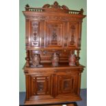 A Victorian carved walnut sideboard