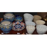 Two trays including jelly moulds, pair of Royal Doulton blue ground jardinieres, Imari plaques, etc