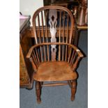 A 19th century oak and elm high back Windsor armchair