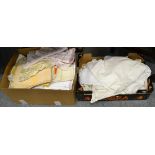 Four boxes of assorted white linen and textiles