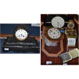 A black slate mantel clock, ebonised mantel clock, brass carriage timepiece,