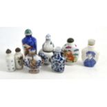 Six Chinese porcelain snuff bottles including a reticulated example