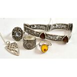 An amber set zoomorphic bracelet, an amber ring, other rings and jewellery