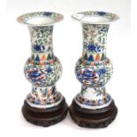 A pair of Chinese Wucai porcelain vases, Wanli reign marks but probably later, painted with