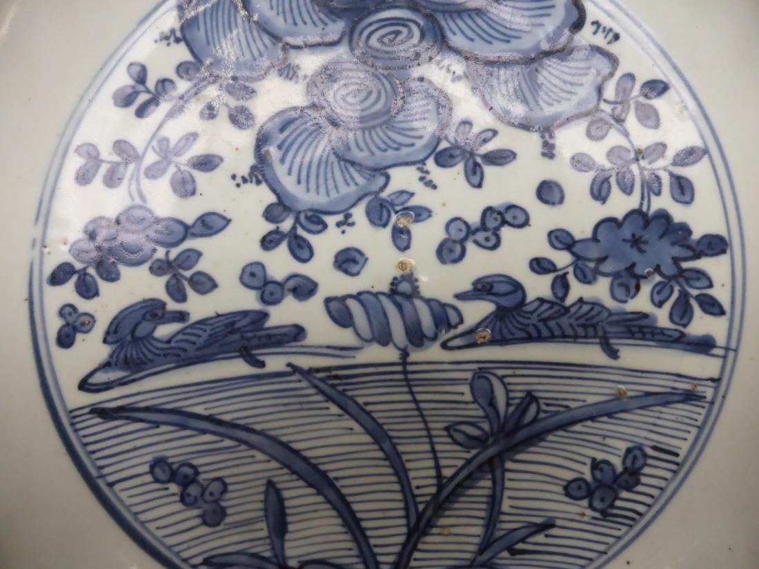 A Chinese porcelain circular dish, early 17th century, painted underglaze blue with ducks on a - Image 3 of 8