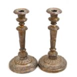 Pair of George IV filled silver candlesticks, with nozzles, Sheffield 1827, 26cm high Marks mostly