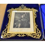 A presentation frame containing a print of Queen Victoria which bears a printed facsimile of Queen