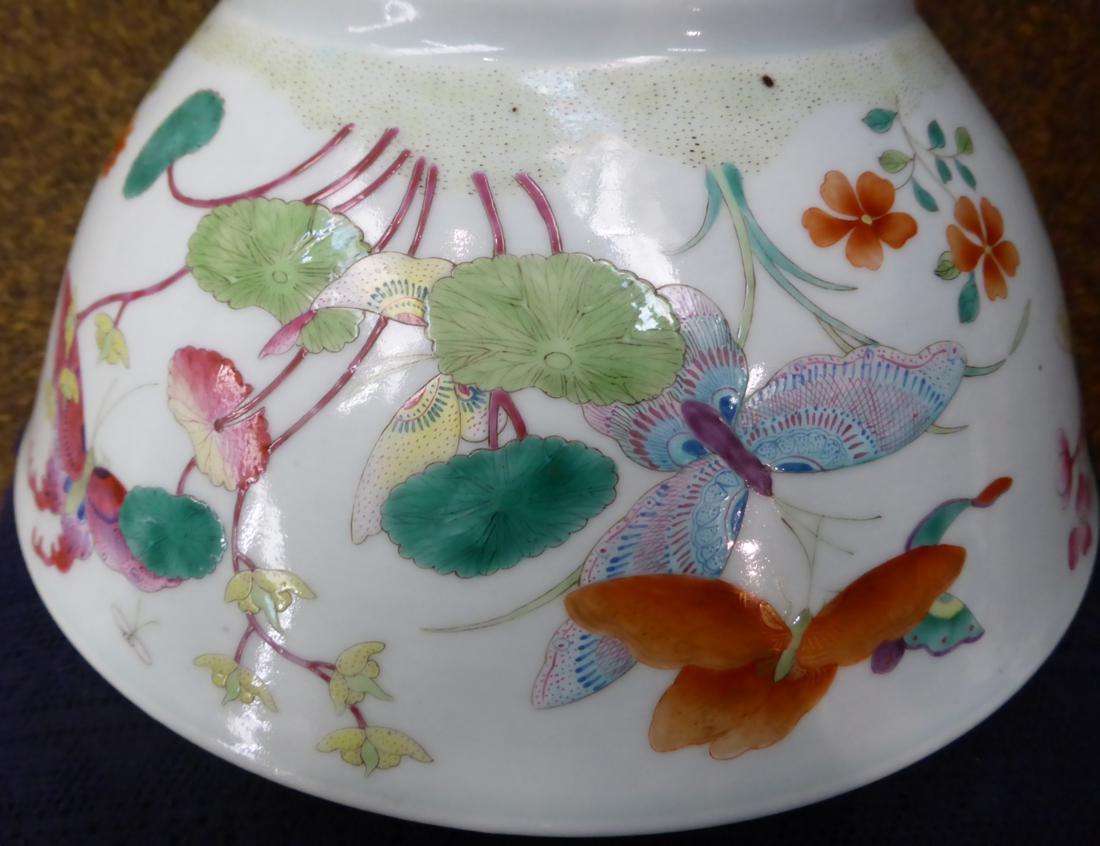 A Chinese porcelain bowl, painted in famille rose enamels with butterflies amongst foliage, bears - Image 7 of 7