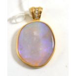 A 9ct gold opal and diamond pendant, the unevenly shaped polished opal within a yellow collet frame,