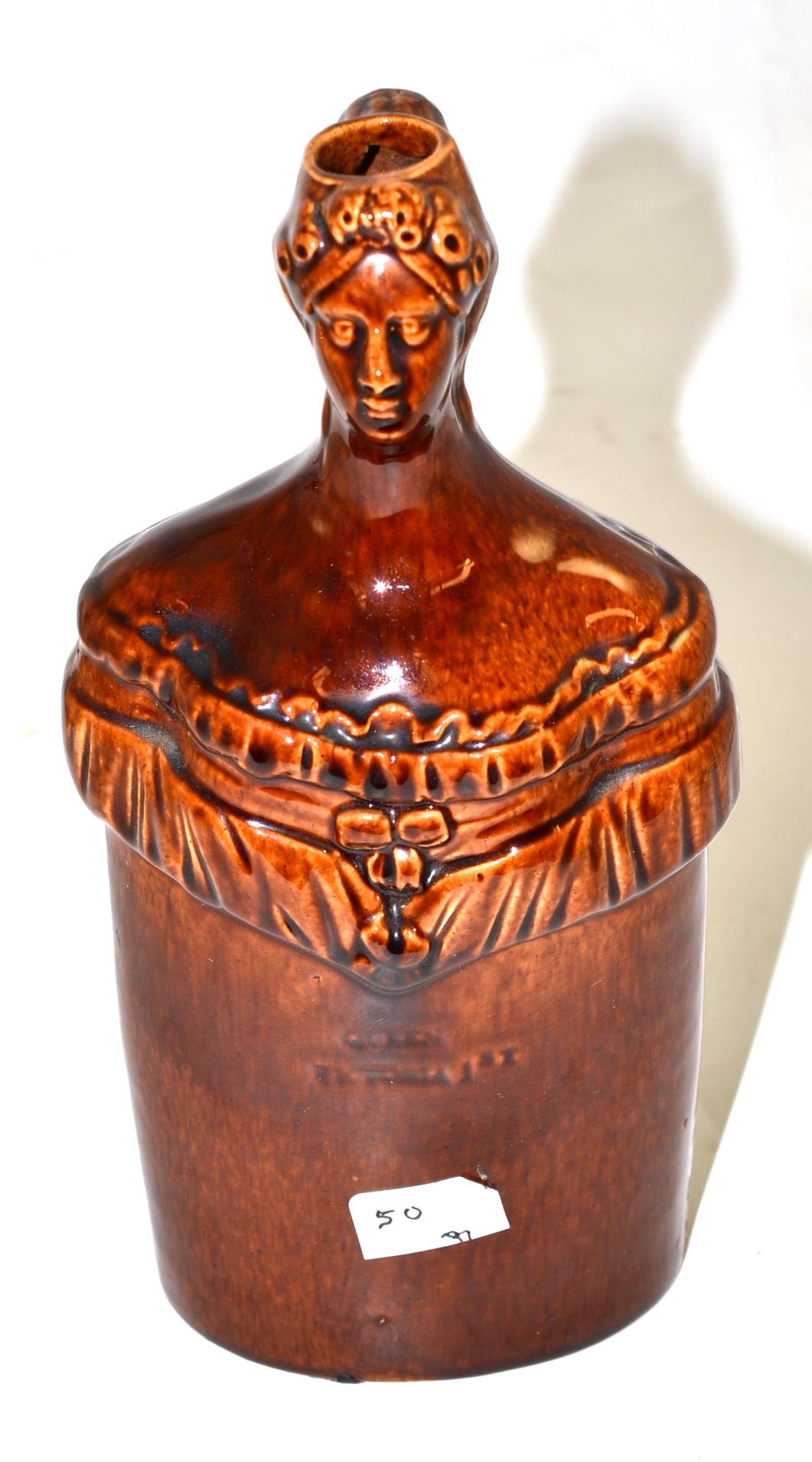 A treacle glazed pottery flask circa 1837, modelled with Victoria, titled ''Queen Victoria 1st'',