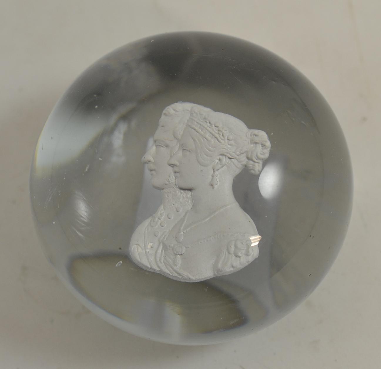 A sulphide paperweight, 19th century, set with bust portraits of Queen Victoria and Prince Albert,