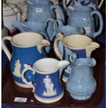 Staffordshire pottery blue ground jug moulded with Queen Victoria; two similar mugs, 14.5cm and 11cm