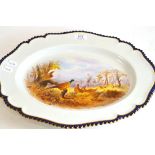 A Royal Worcester meat plate, painted with pheasants, monogrammed CJ