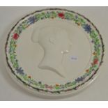 A pearlware circular plaque, possibly Scottish, circa 1837, moulded with a bust of Queen Victoria